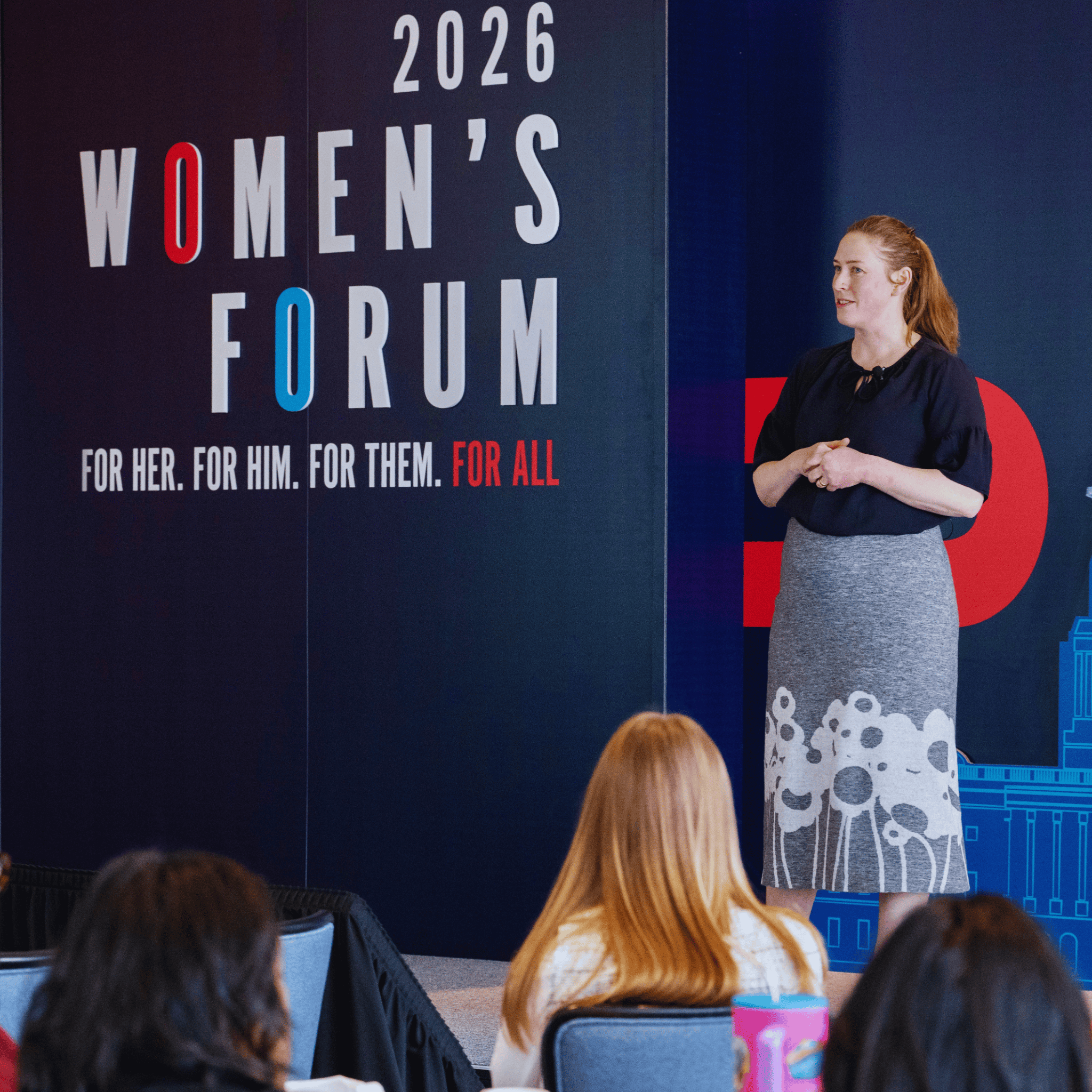 Kelsey speaking to a group of people at the 2026 Georgetown Women's Forum